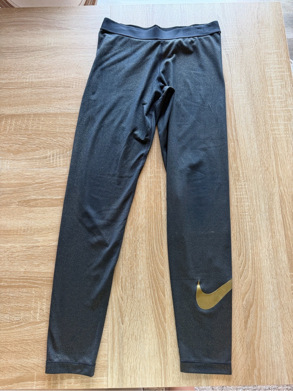 Nike Black Leggings with Gold Swoosh